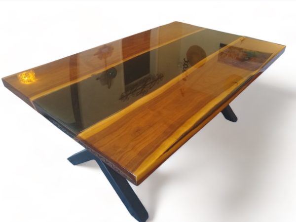 Black River Coffee table made of American walnut, covered with layers of transparent crystal clear resin, with stainless steel X shape legs.